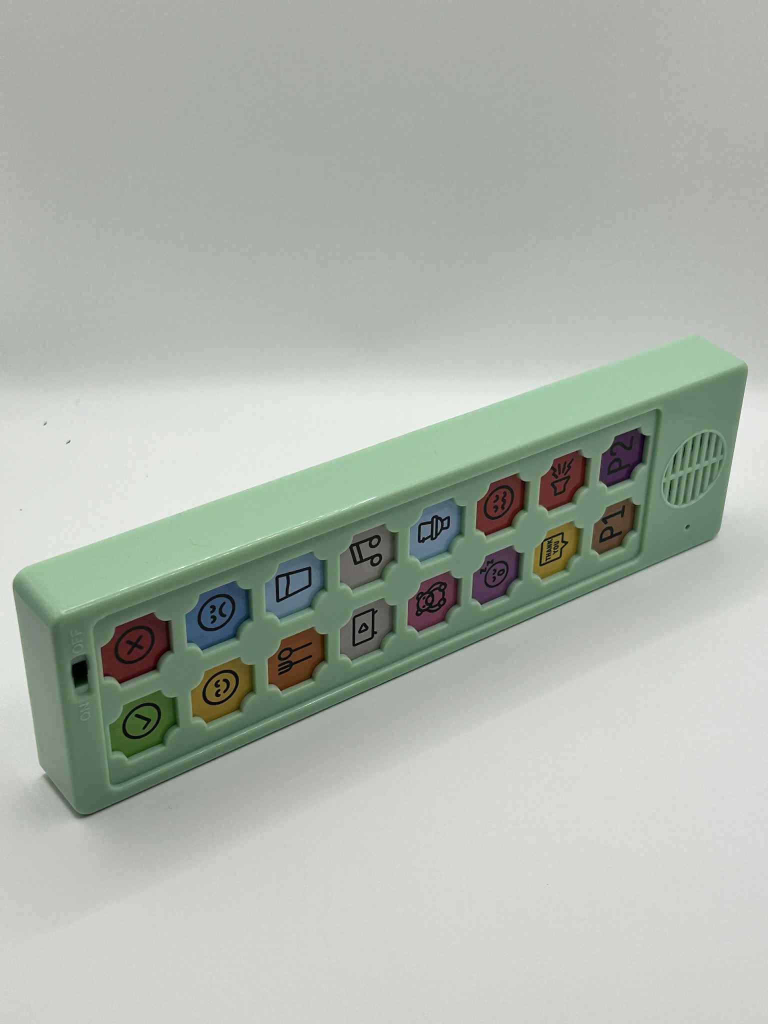 Close-up on a side angle of ASD Communication Device showing the length of the device and buttons for visual learning