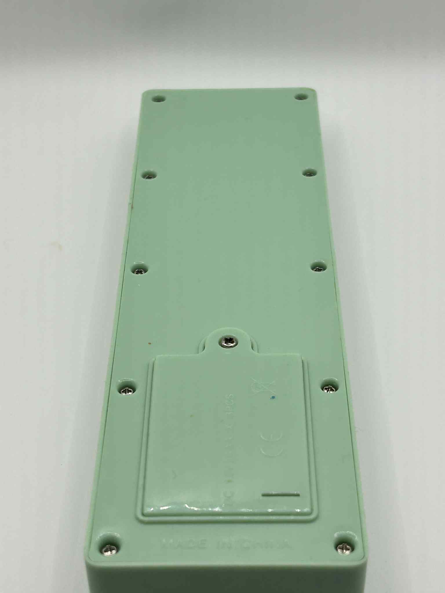 Close-up of ASD Communication Device showing the back side of it where the batteries are inserted