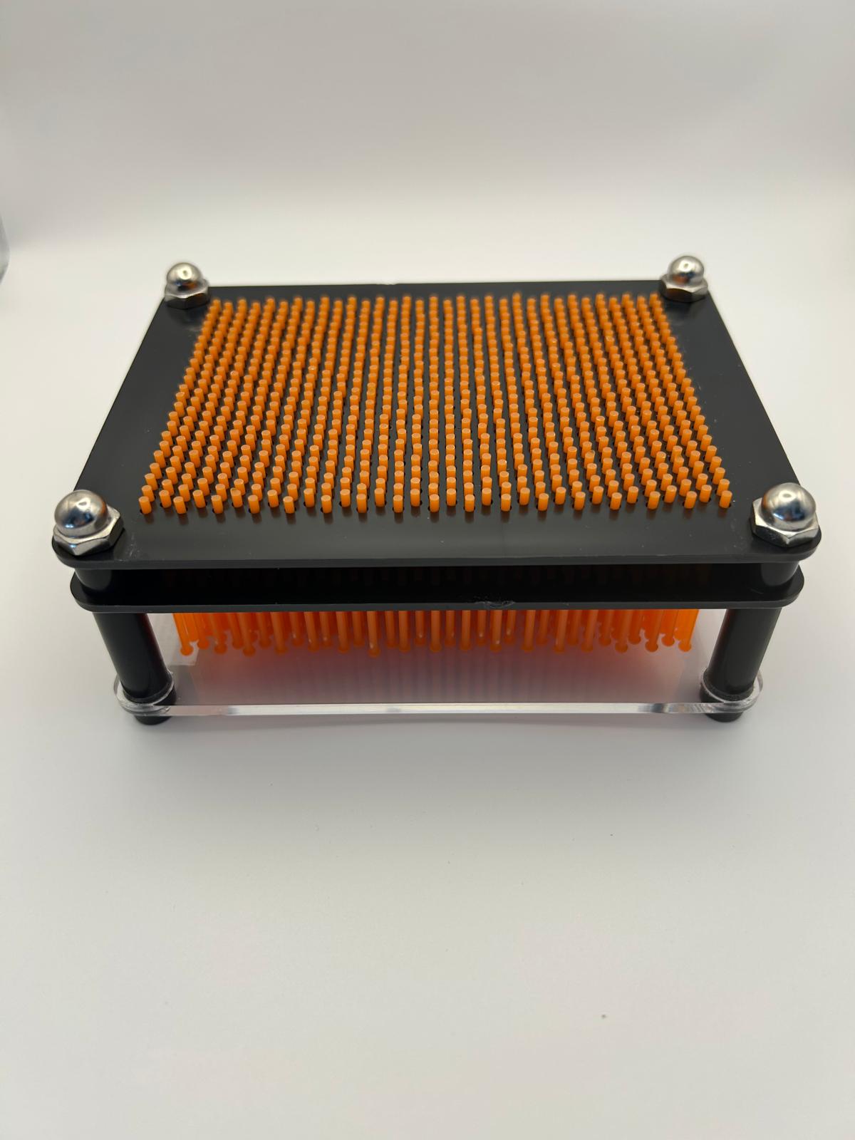 Neuro Touch 3D Impression Kit – sensory pin art toy for autism and ADHD by The Divergent Den laid down for you to see the underneath where the hand is placed to create impressions