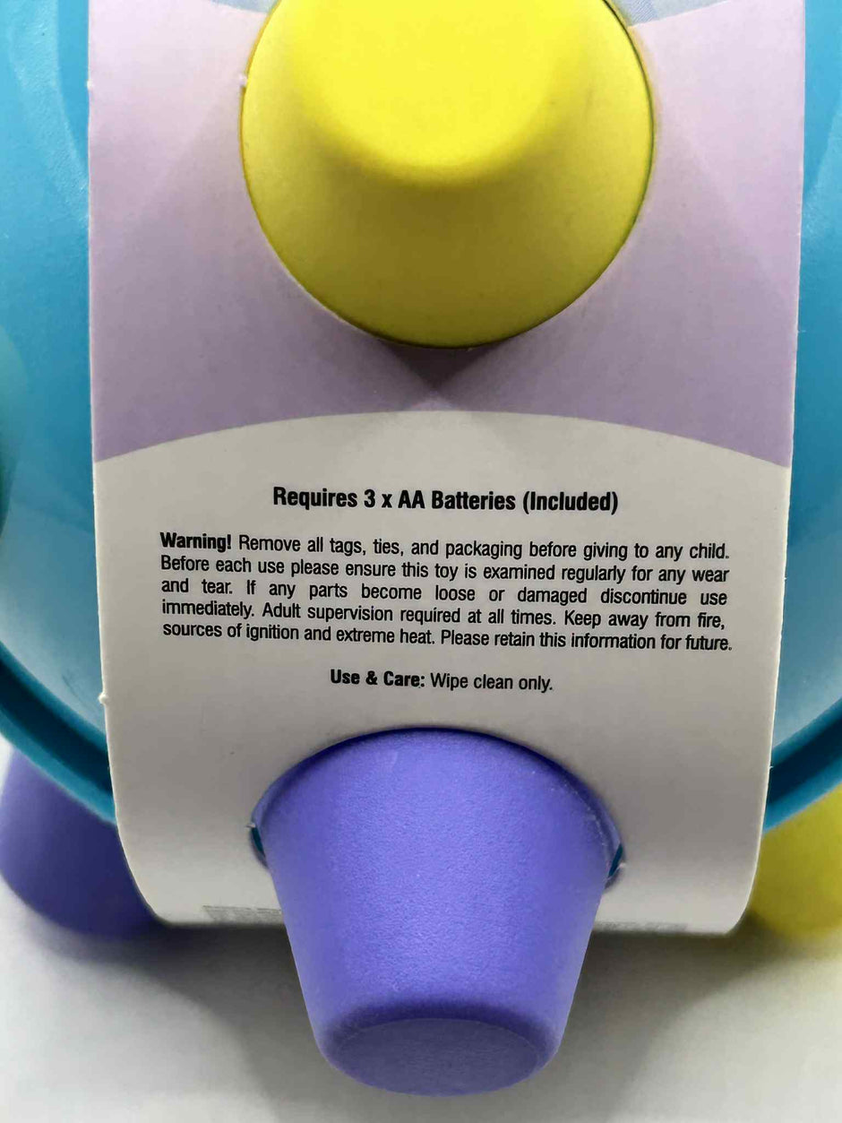 Sensory Bumpie Ball showing the battery info and the warning label – tactile fidget and stress-relief toy for neurodivergent children | The Divergent Den”