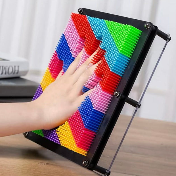 Hand pressing into Neuro Touch 3D Rainbow Pin Art – tactile sensory tool for focus and calm by The Divergent Den