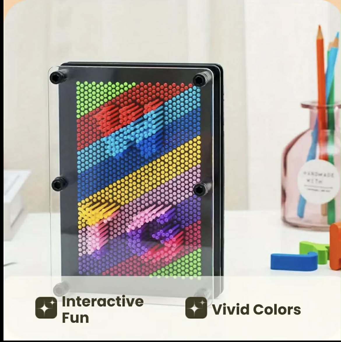 3D Rainbow Pin Art – sensory pin art toy for autism and ADHD by The Divergent Den laid down for you to see the underneath where the hand is placed to create impressions 
