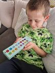 Child using ASD Communication Device to support communication and language development for autism
