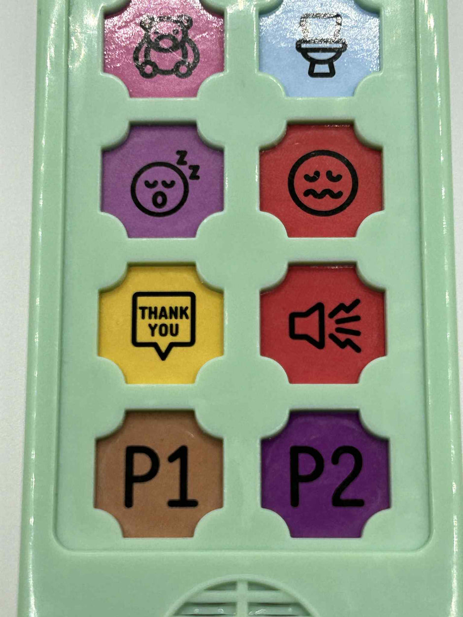 Close-up of ASD Communication Device showing colourful communication buttons and icons for visual learning