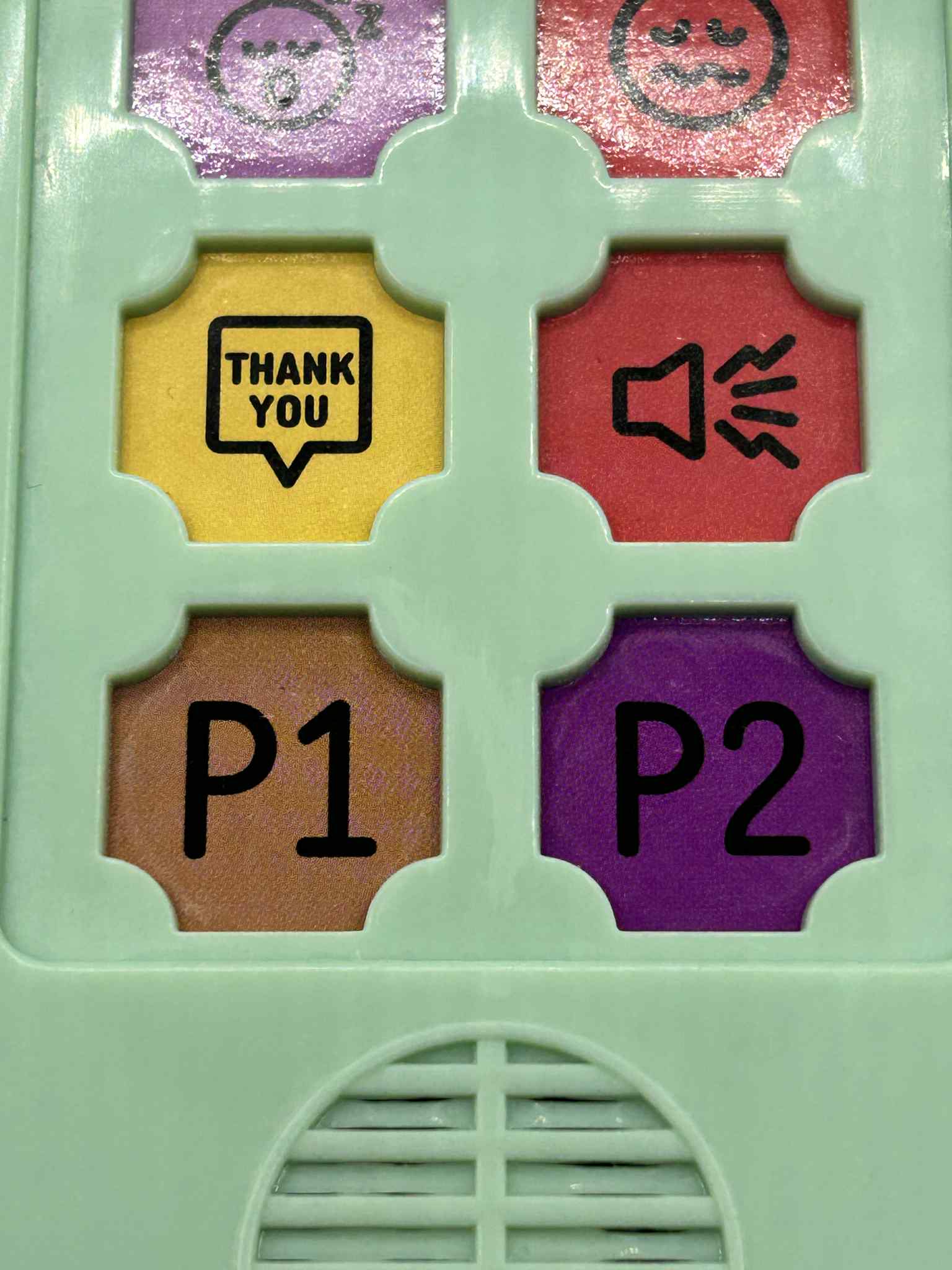 Close-up of ASD Communication Device showing colourful communication buttons and icons for visual learning