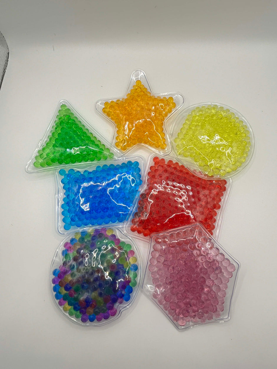 Colorful star-shaped gel beads in clear containers on a white background