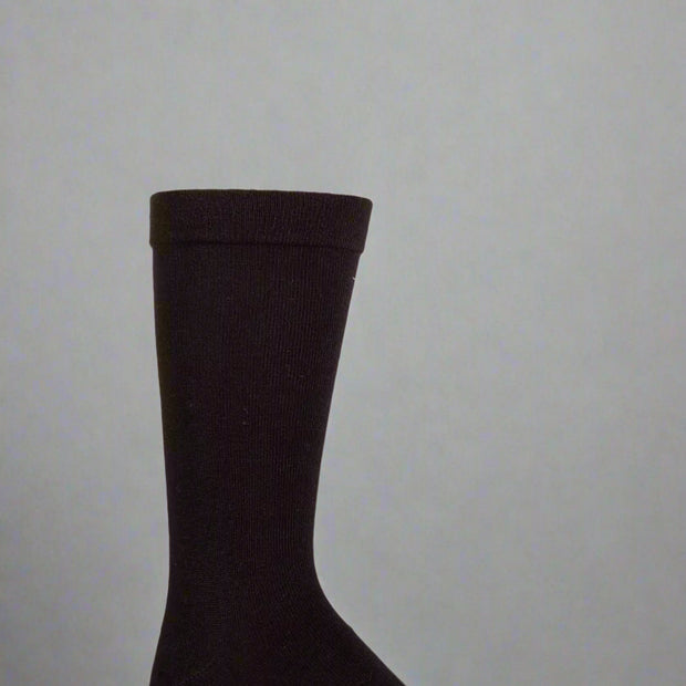 black bamboo sock on a white background showing the quality of the material for feet which need seamless feel