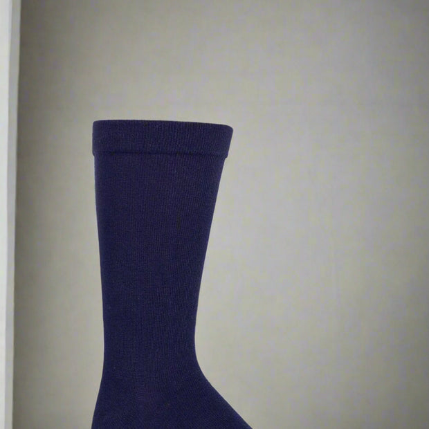 Navy blue bamboo sock on a white background showing the quality of the material for feet which need seamless feel
