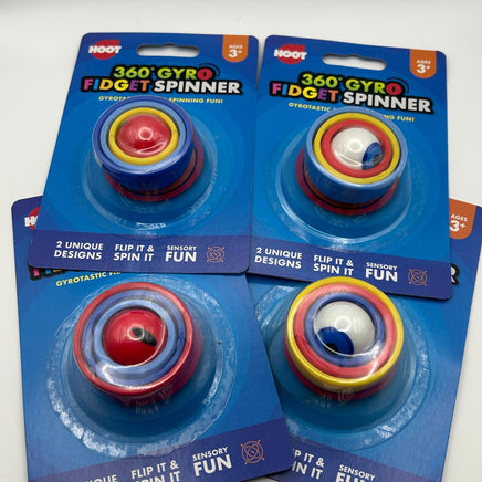 Four packages of 360 Gyro Fidget Spinners on a gray background