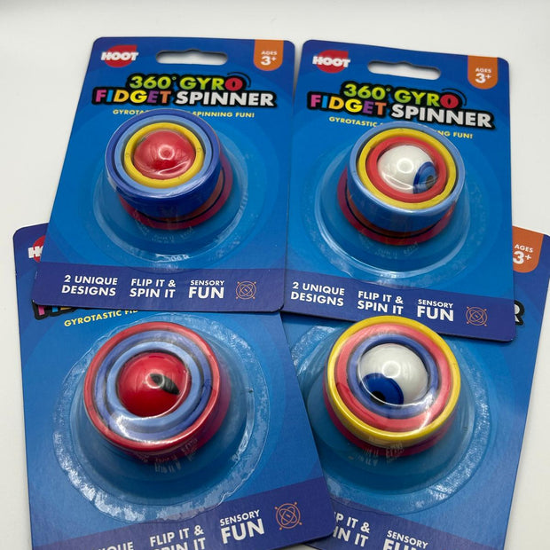 Four packages of 360 Gyro Fidget Spinners on a gray background