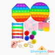 Collection of colorful sensory toys with a hand pointing to them, on a white background. Divergent Den logo visible.