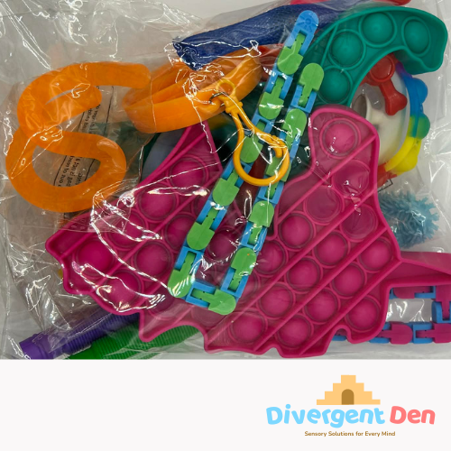 The Divergent Den | Showcasing the 20 piece fidget set, Packaged colourful pop-it fidget toys on a white background.