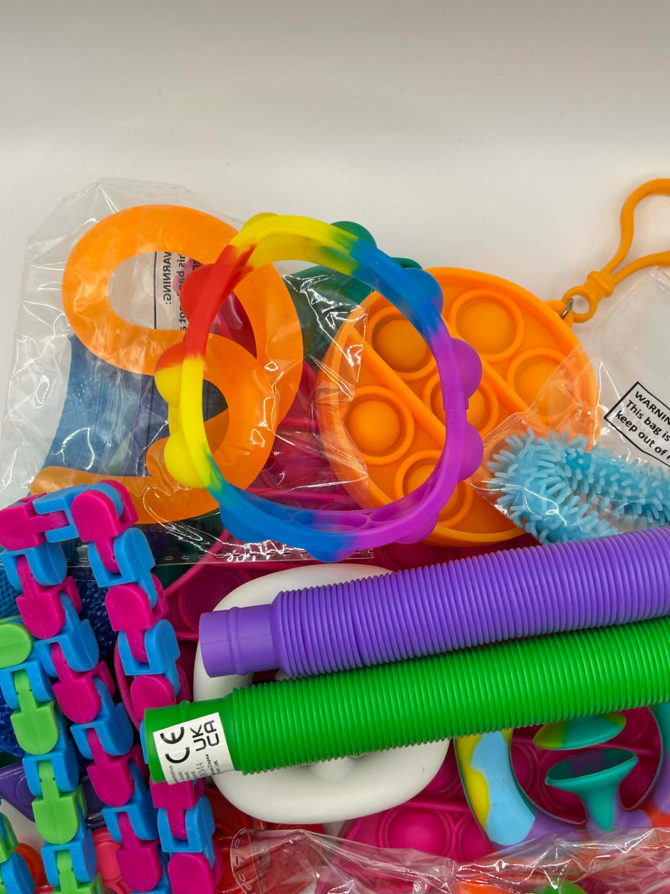 Comprehensive fidget bundle featuring 15-20 sensory tools for calming, focus, and fine motor skill development