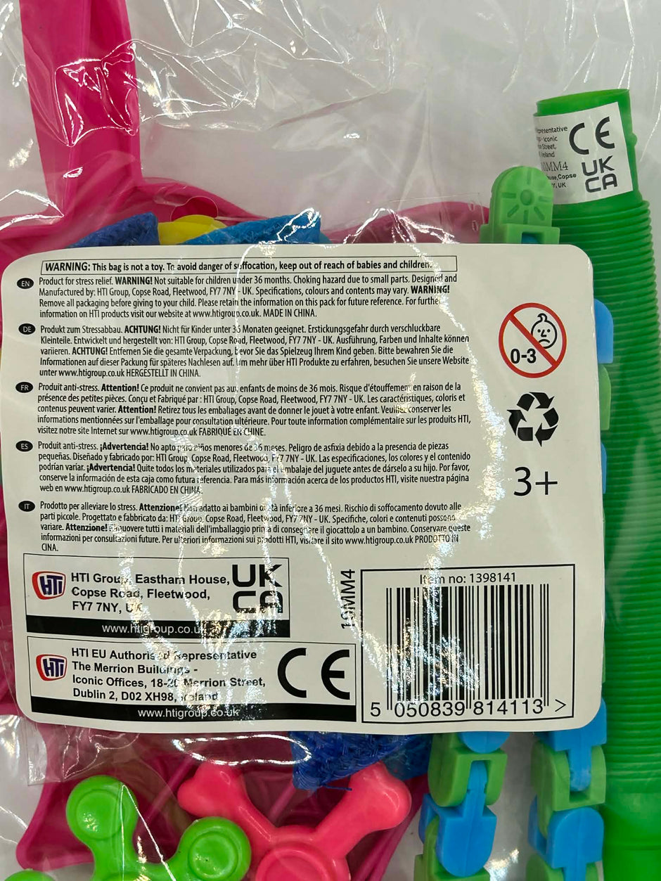Back of a package with colorful fidget spinners and safety warning labels.