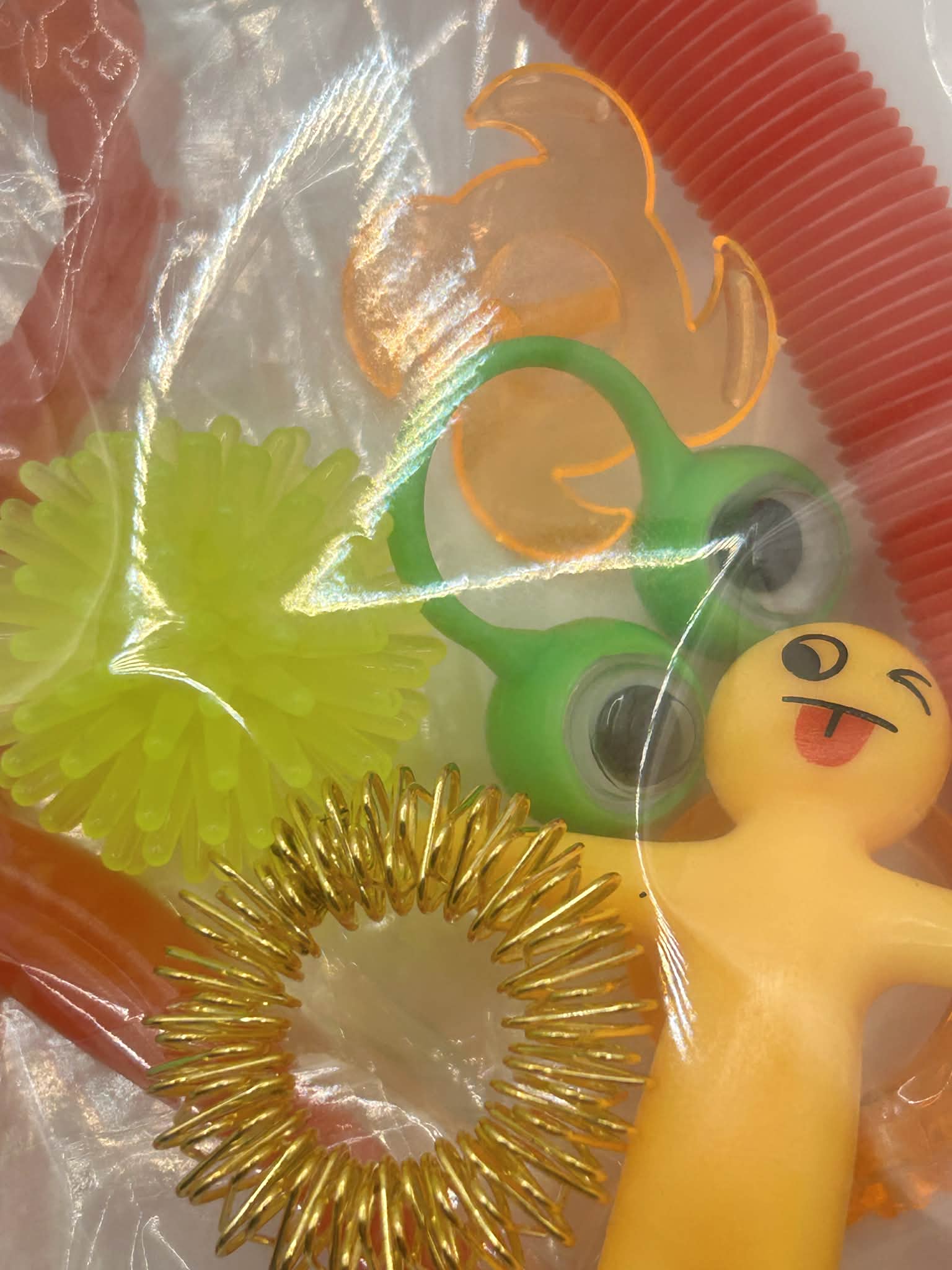 Sensory fidget bundle with spinning tops, stretchy rings and tactile toys for neurodivergent children