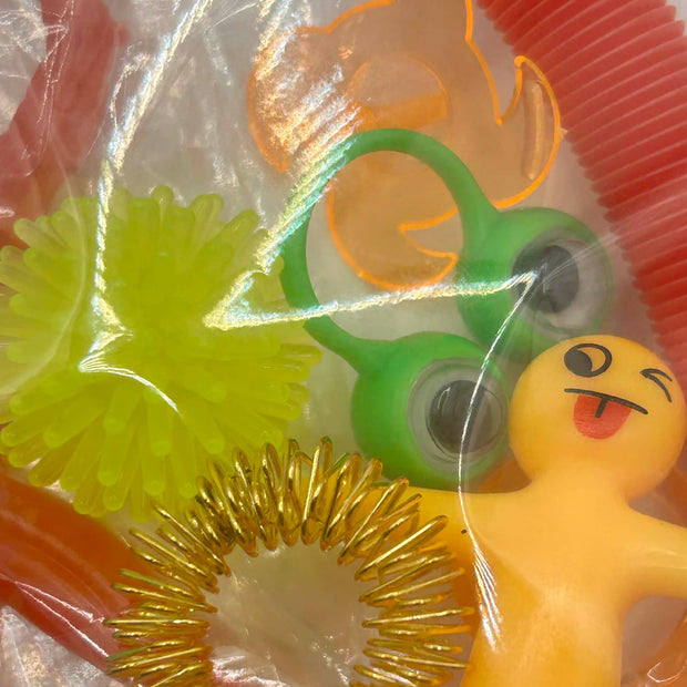 Sensory fidget bundle with spinning tops, stretchy rings and tactile toys for neurodivergent children