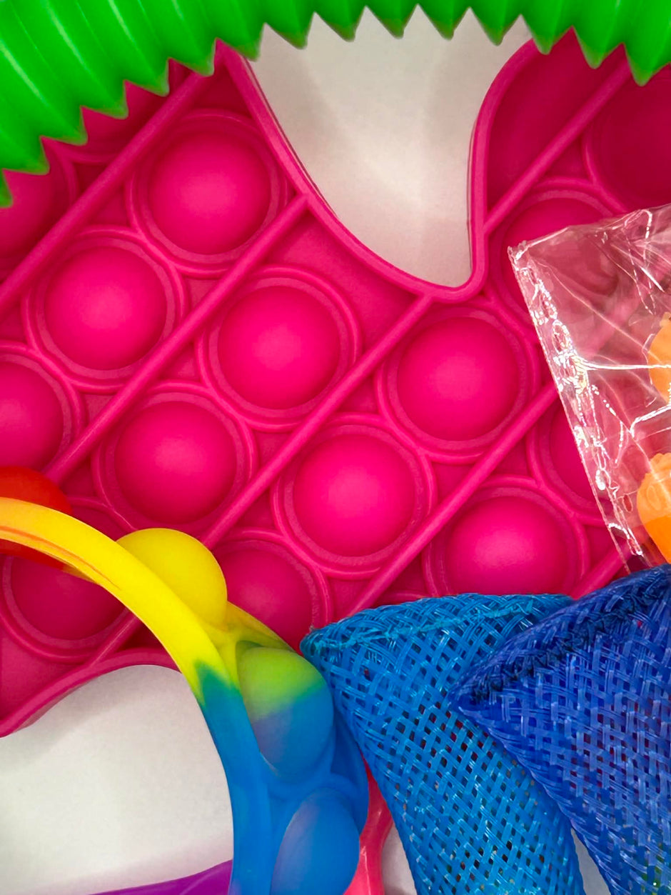 Variety of fidget toys and sensory tools from bundle including stress relief and focus aids