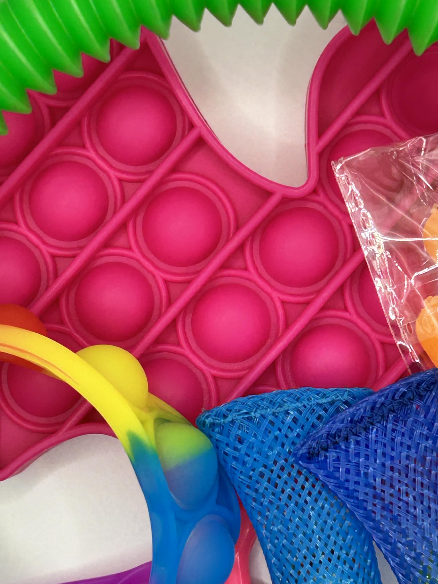 Variety of fidget toys and sensory tools from bundle including stress relief and focus aids