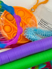Curated fidget bundle with 9, 12 and 20 piece premium sensory tools including stress balls, fidget spinners, and tactile manipulatives for focus and calm