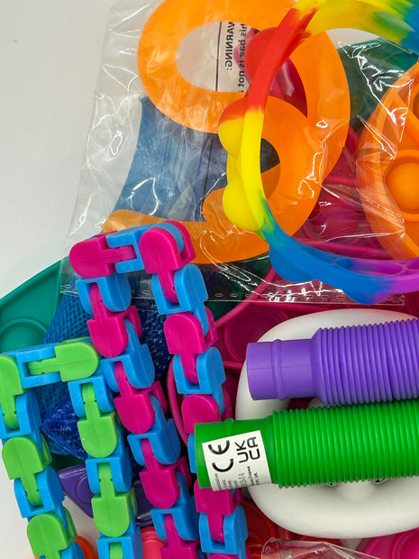 Assorted fidget tools and sensory aids arranged to show variety of textures and types for ADHD and autism support