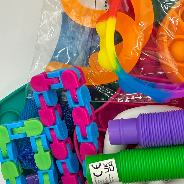 Assorted fidget tools and sensory aids arranged to show variety of textures and types for ADHD and autism support