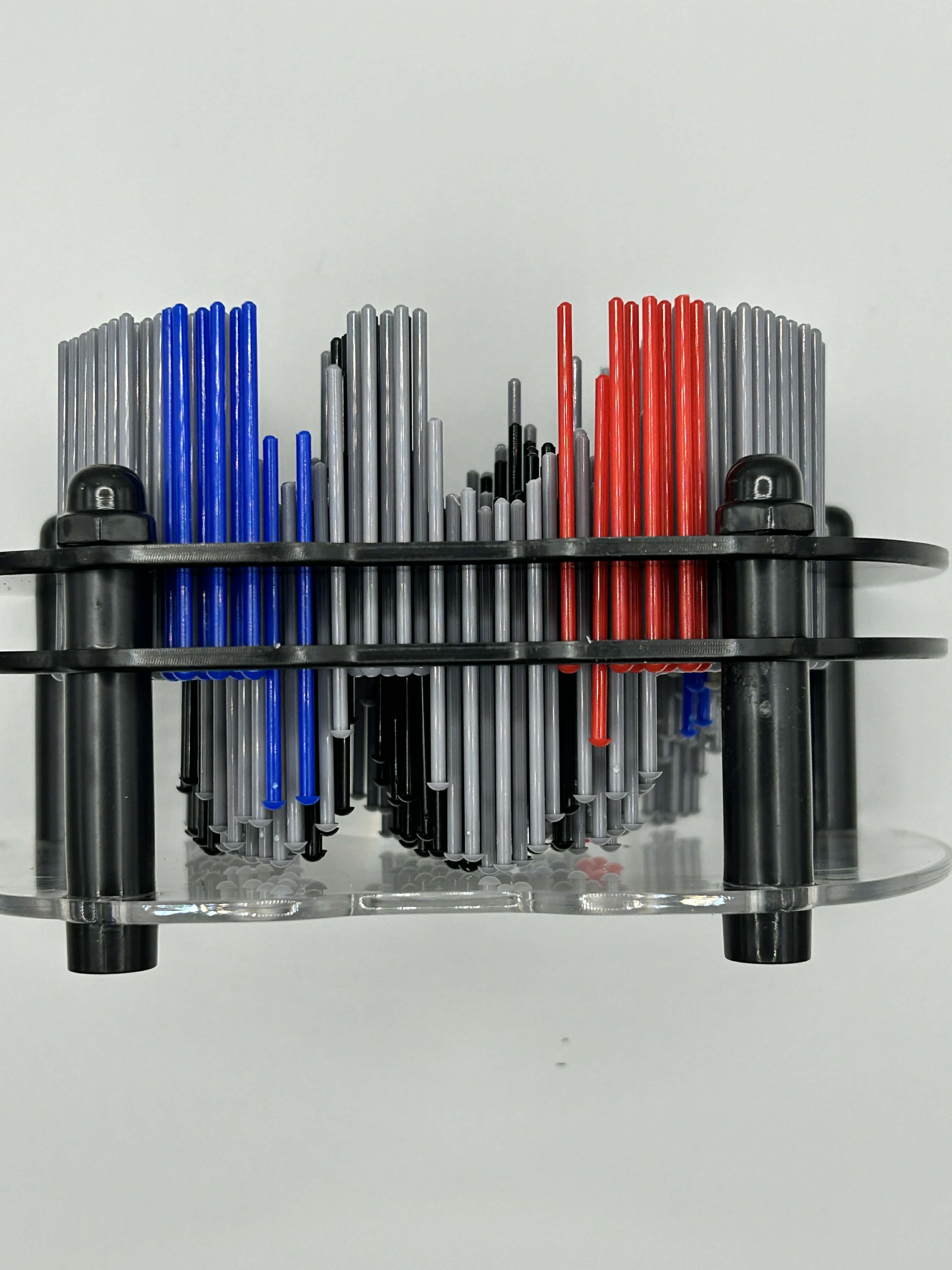 Child pressing pins on games controller pin art tactile sensory fidget for focus and self-regulation