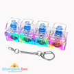 Colorful sensory keychain with clear cube design on a white background, featuring the Divergent Den logo. Keyboard clicker fidget