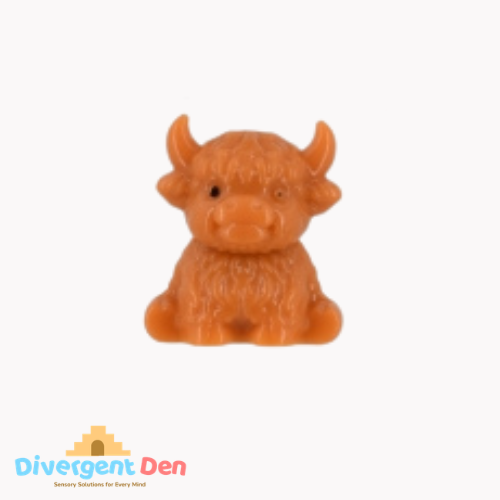 Squeeze toy Highland cow with packaging on a white background