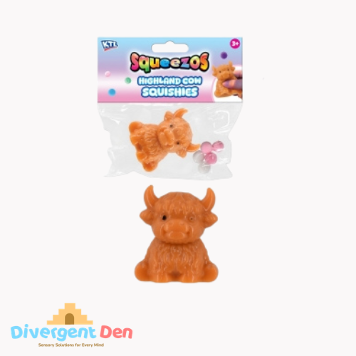 Squeeze toy Highland cow with packaging on a white background