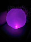 Inflatable 45cm Glow Ball glowing bright purple – sensory light toy for kids by The Divergent Den