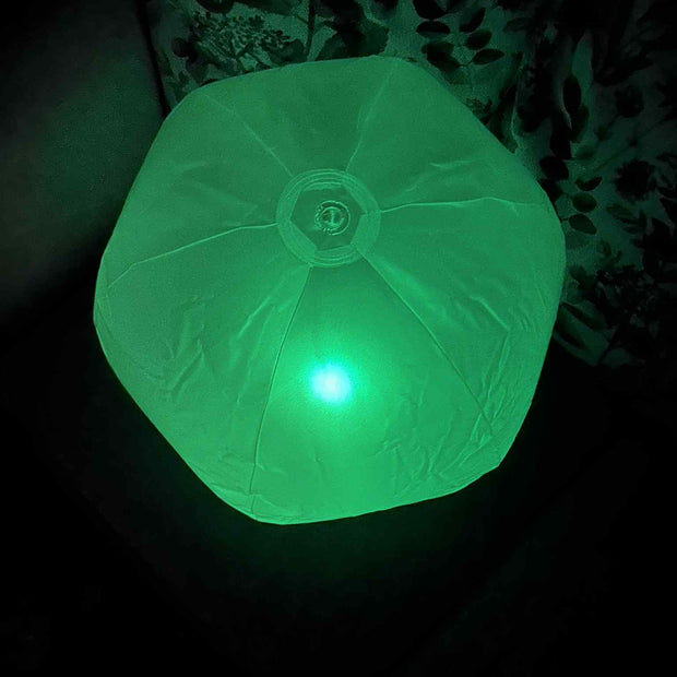 Inflatable 45cm Glow Ball glowing bright green– sensory light toy for kids by The Divergent Den