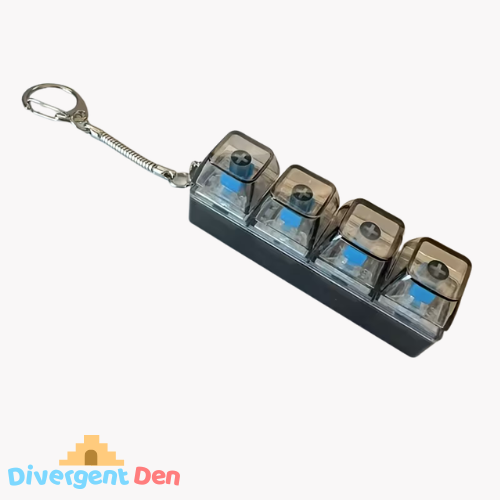 Keyboard fidget toy with four transparent compartments and a metal clip on a white background, branded with 'Divergent Den'.