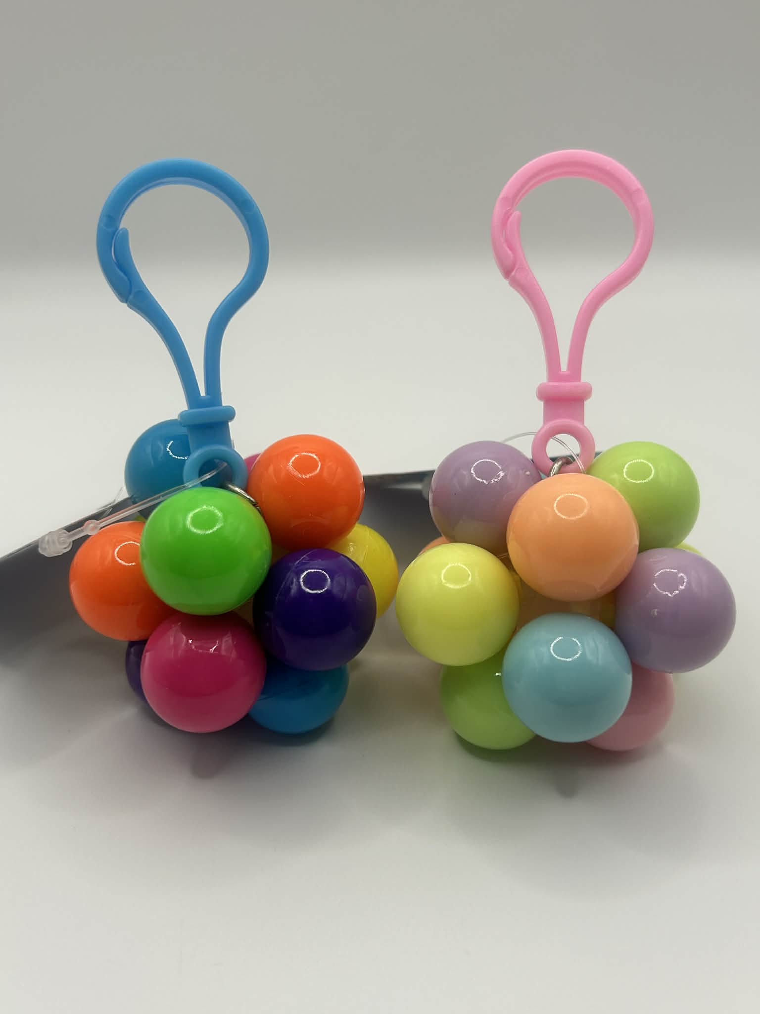 Key ring Fidget Atom close-up showing multi-coloured tactile buttons for stress relief and focus