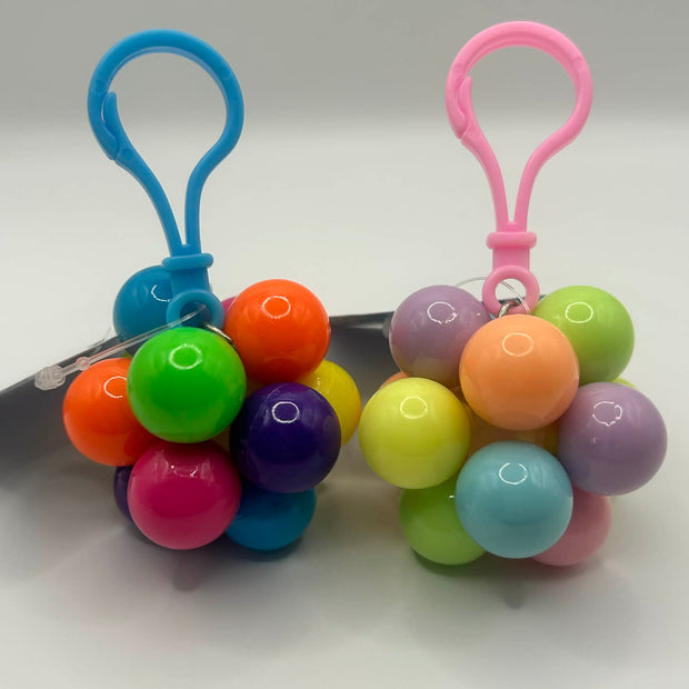 Key ring Fidget Atom close-up showing multi-coloured tactile buttons for stress relief and focus