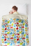Child using Dino Kids Weighted Blanket for autism and ADHD-friendly sensory support and relaxation