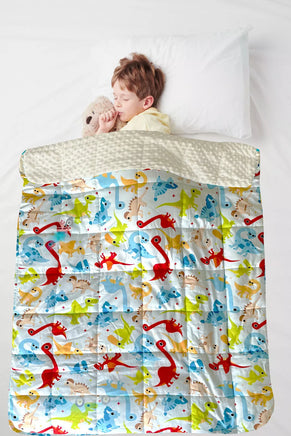 Child using Dino Kids Weighted Blanket for autism and ADHD-friendly sensory support and relaxation