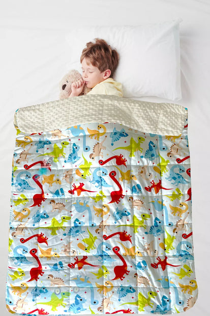 Child using Dino Kids Weighted Blanket for autism and ADHD-friendly sensory support and relaxation