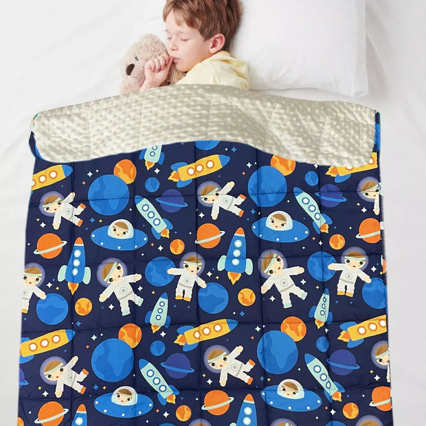 Child using Kids Weighted Blanket Space Style for autism and ADHD-friendly sensory support and relaxation
