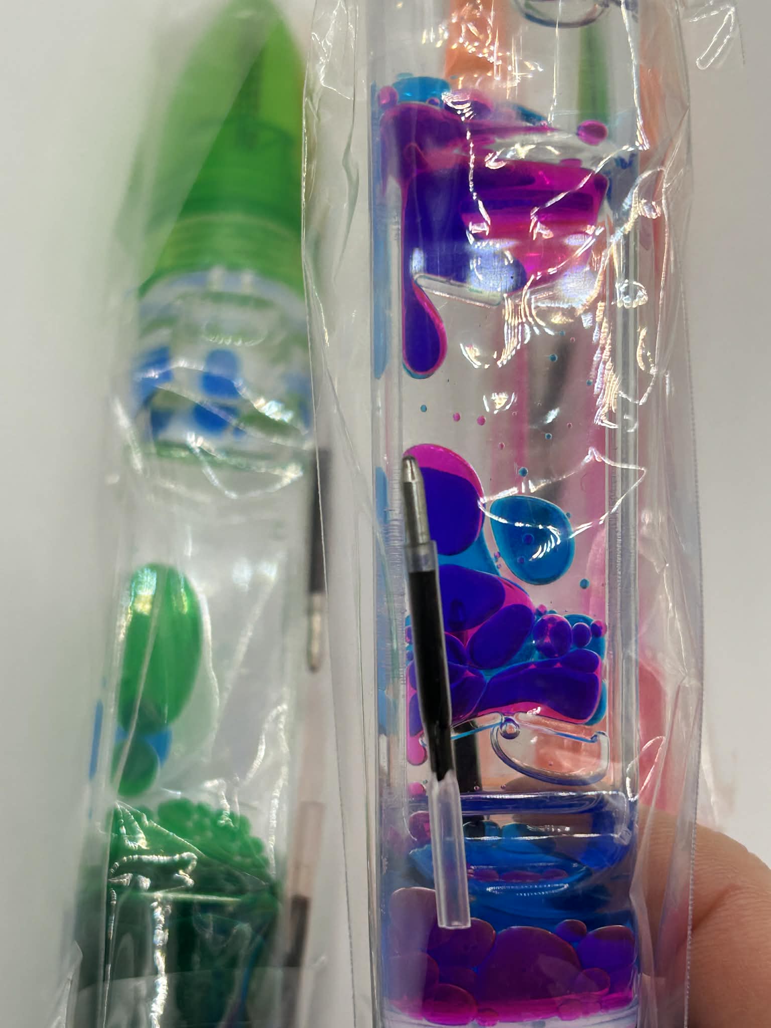 close up on the bubble falling in the Liquid motion pen for calming stimulation for neurodivergent children and adults 