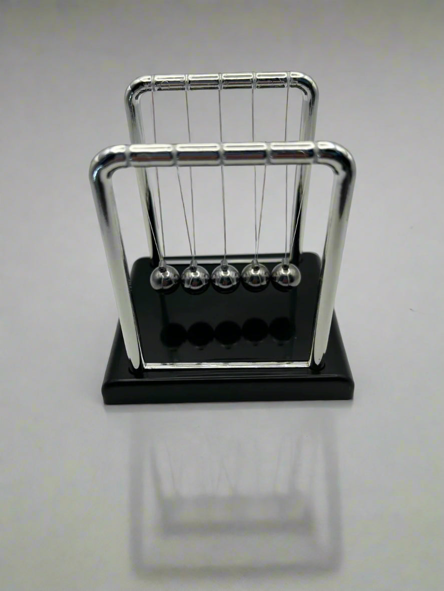 Newton’s Cradle – classic desk fidget toy for focus and stress relief | The Divergent Den