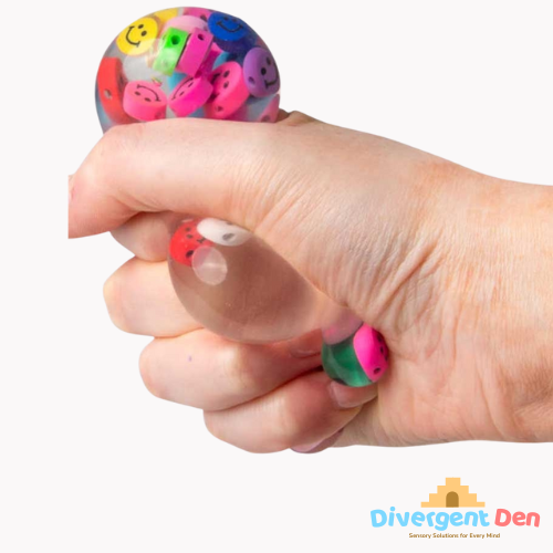 Six sensory fidget toys from Scrunchems box including sugar marble ball squish balls foam bear and colour change ball