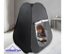 Sensory Blackout Tent with a child inside, sitting on a white floor with a neutral background. | The Divergent Den