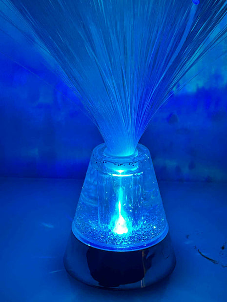Close-up of Sensory Fibre Optic Lamp showing glowing fibre strands and colour-changing light base