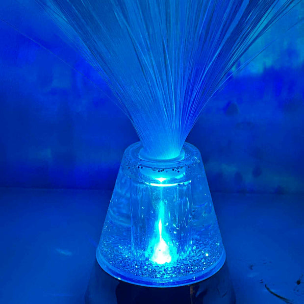Close-up of Sensory Fibre Optic Lamp showing glowing fibre strands and colour-changing light base