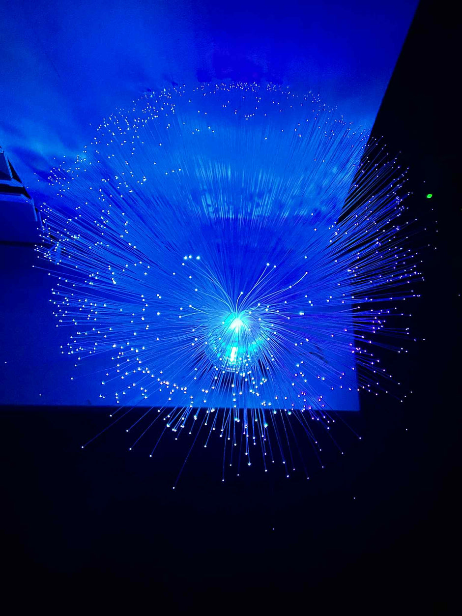 Child watching Sensory Fibre Optic Lamp for relaxation and visual sensory stimulation