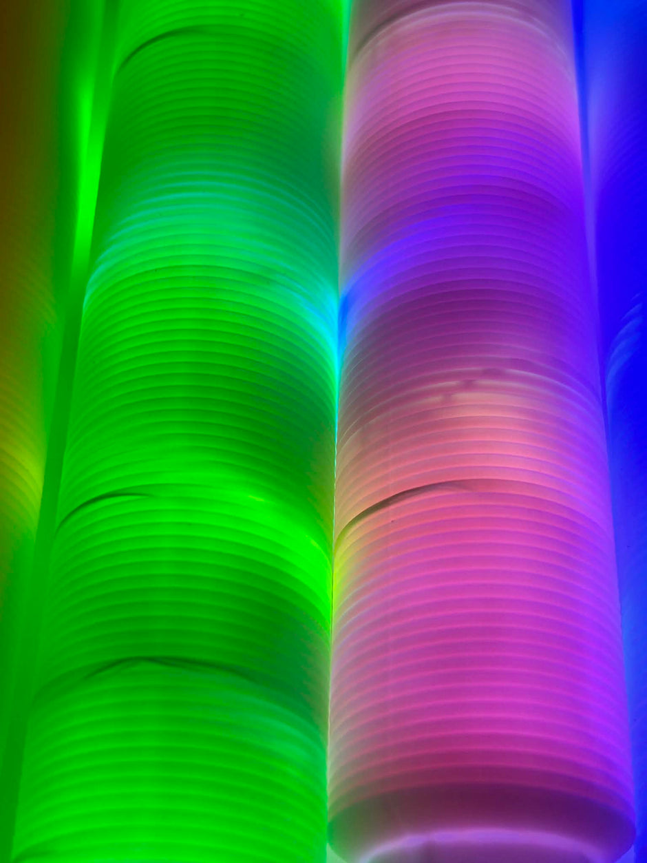 Close Up Sensory Light Up Pop Tubes laid out to see the colours lighting up – flexible fidget toy with LED lights for neurodivergent children | The Divergent Den