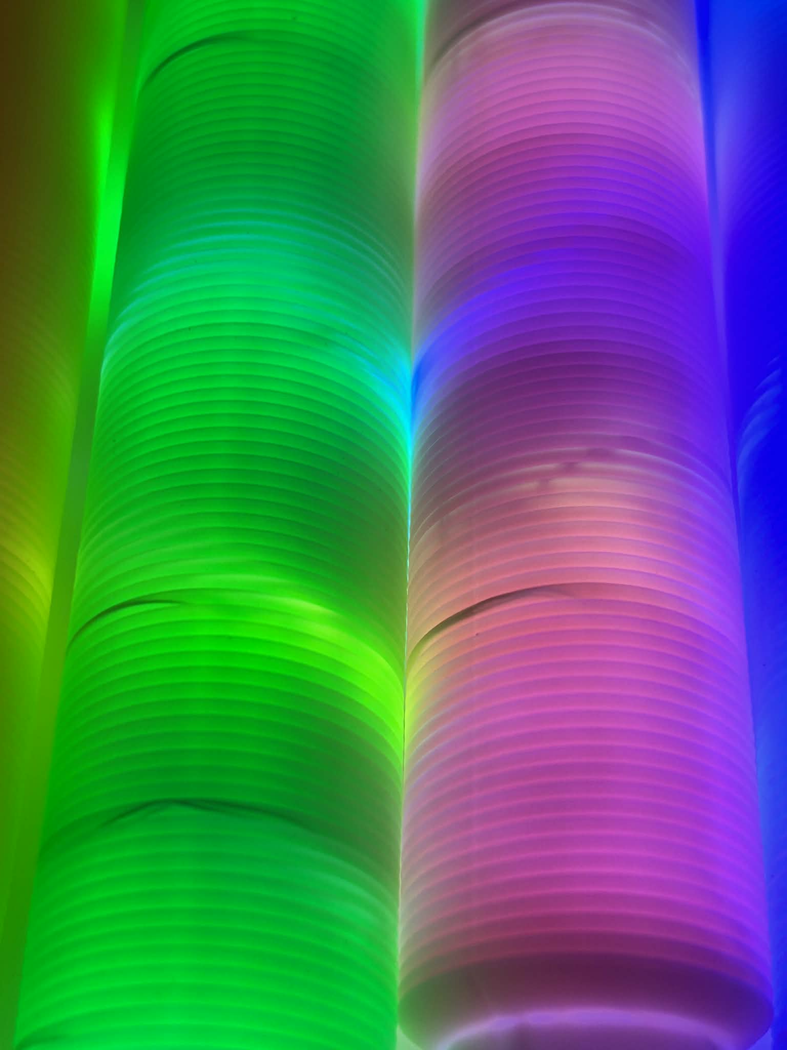 Close Up Sensory Light Up Pop Tubes laid out to see the colours lighting up – flexible fidget toy with LED lights for neurodivergent children | The Divergent Den