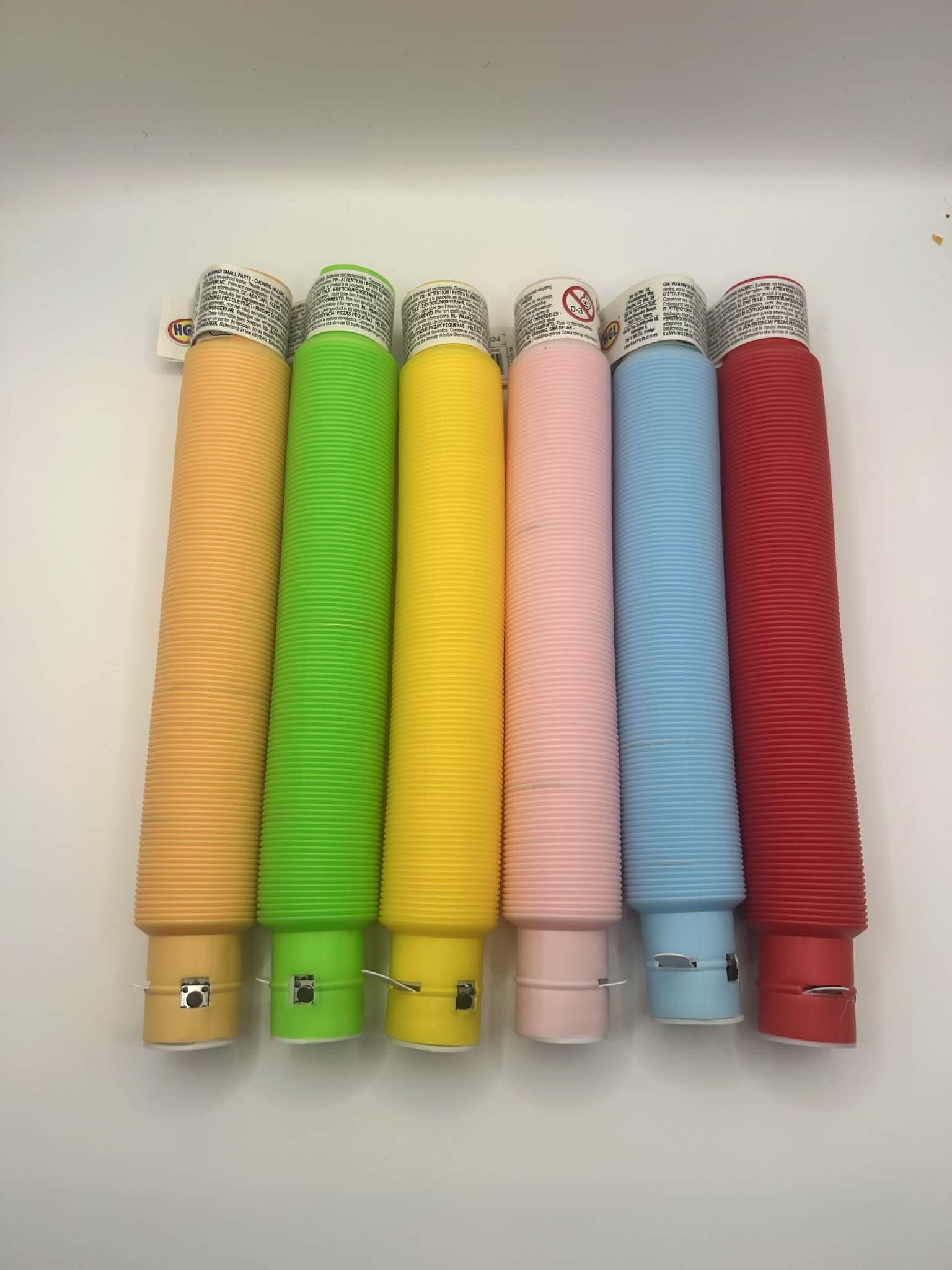 Sensory Light Up Pop Tubes, light showing the colours without the led turned on – flexible fidget toy with LED lights for neurodivergent children | The Divergent Den