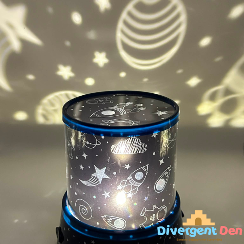 Space-themed night light projector with celestial designs on a gray background