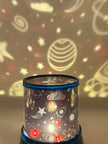 Sensory night light projector showing Cosmic-themed night light projecting celestial designs on a wall - The Divergent Den